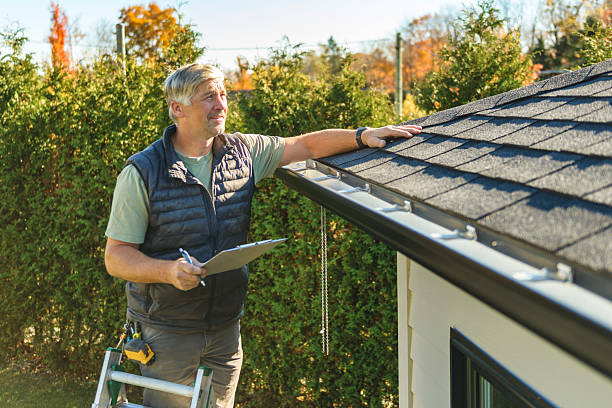 Professional Hail Damage Roof Repair technician working in Morris, NY